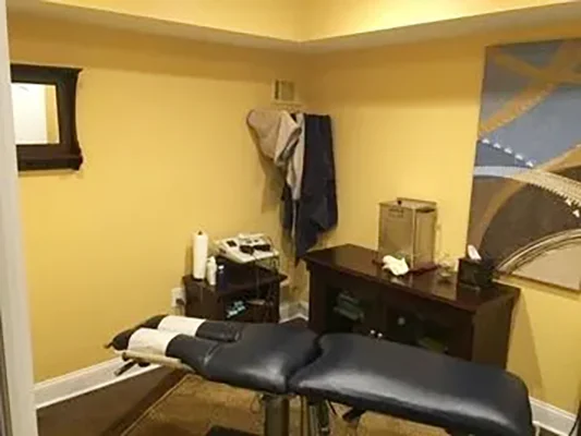 Chiropractic Succasunna NJ Black Adjustment Table A chiropractic treatment room at Succasunna Chiropractic & Spine Rehab with an adjustment table
