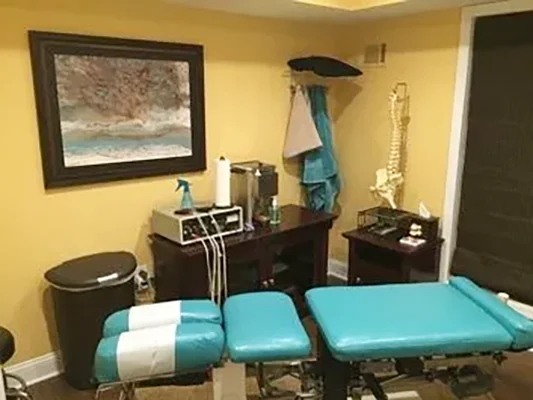Chiropractic Succasunna NJ Teal Adjustment Table An adjustment room at Succasunna Chiropractic & Spine Rehab with chiropractic treatment and examination tools